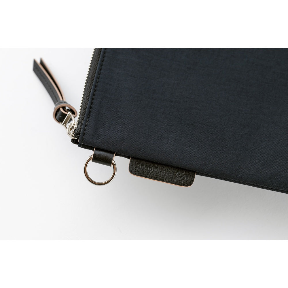 Black zippered pouch with a visible brand logo on a white background