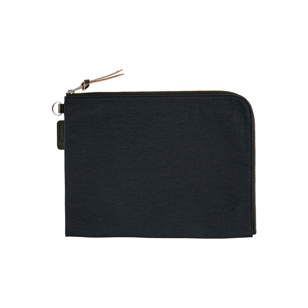 A black A6 zippered Tragen flat pouch on white background