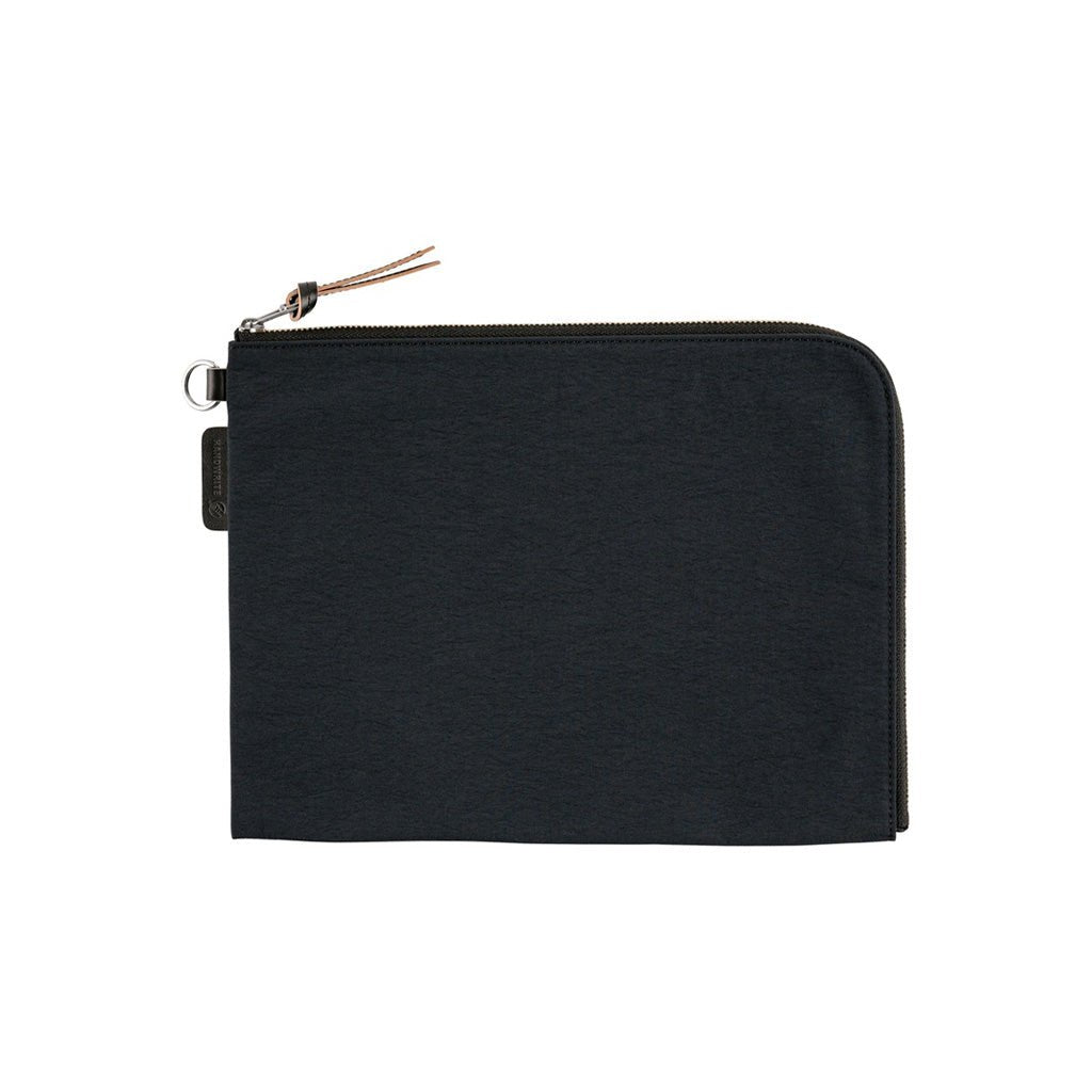 A black A6 zippered Tragen flat pouch on white background