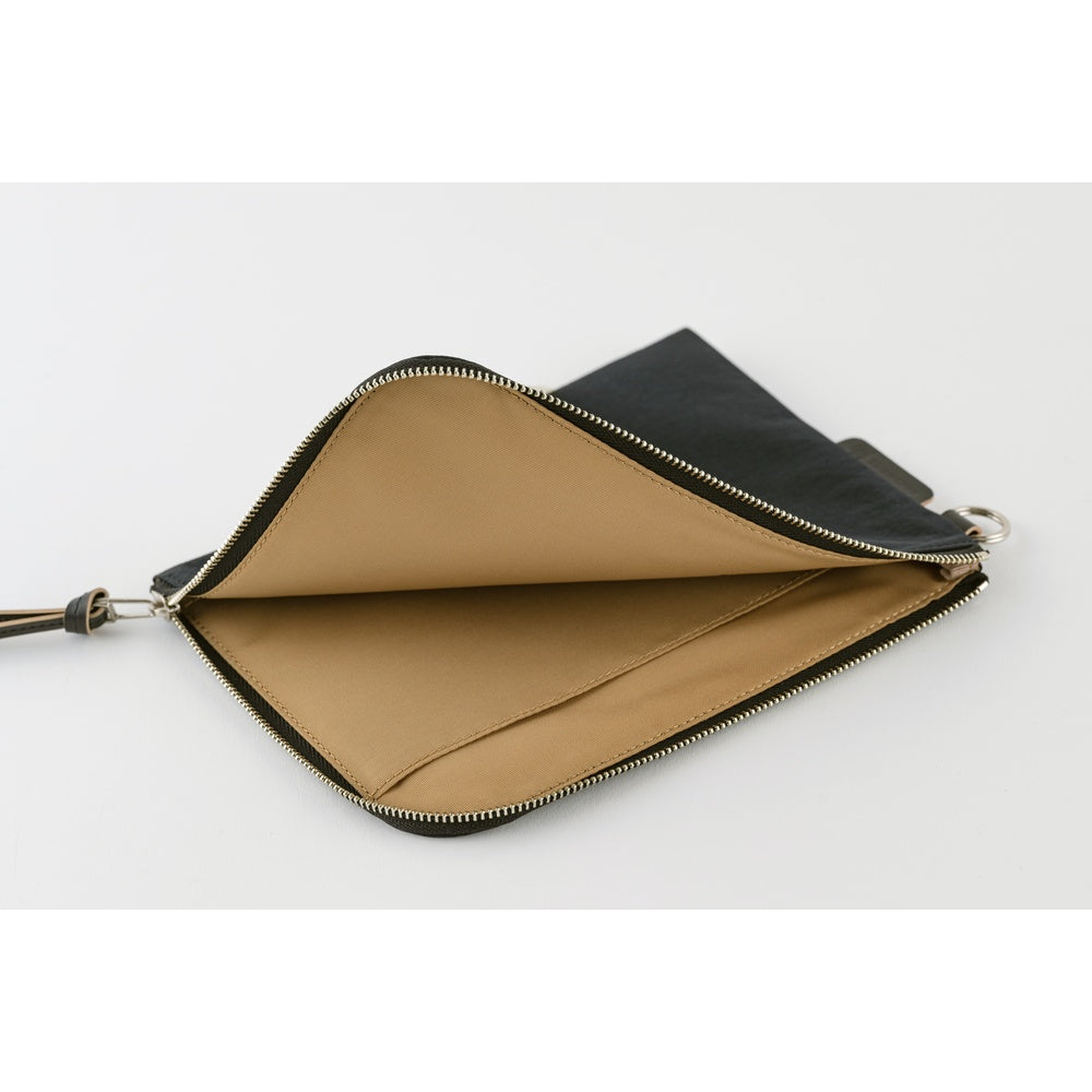 An open zippered pouch with a tan interior lining and a black exterior, shown on a clean white background.