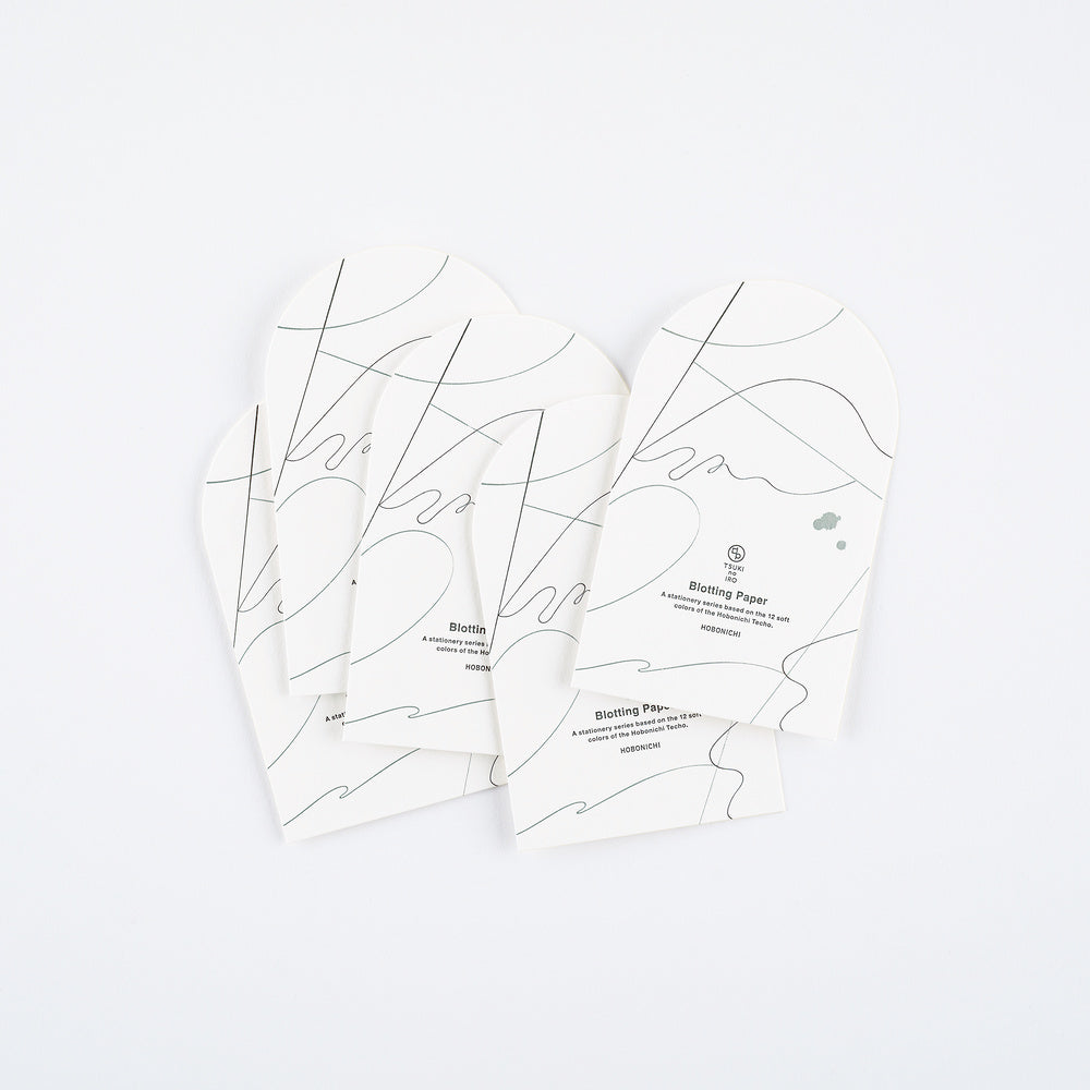 Four arched sheets of blotting paper shown on a clean white background. The papers feature minimalist black abstract line art and text detailing its features.