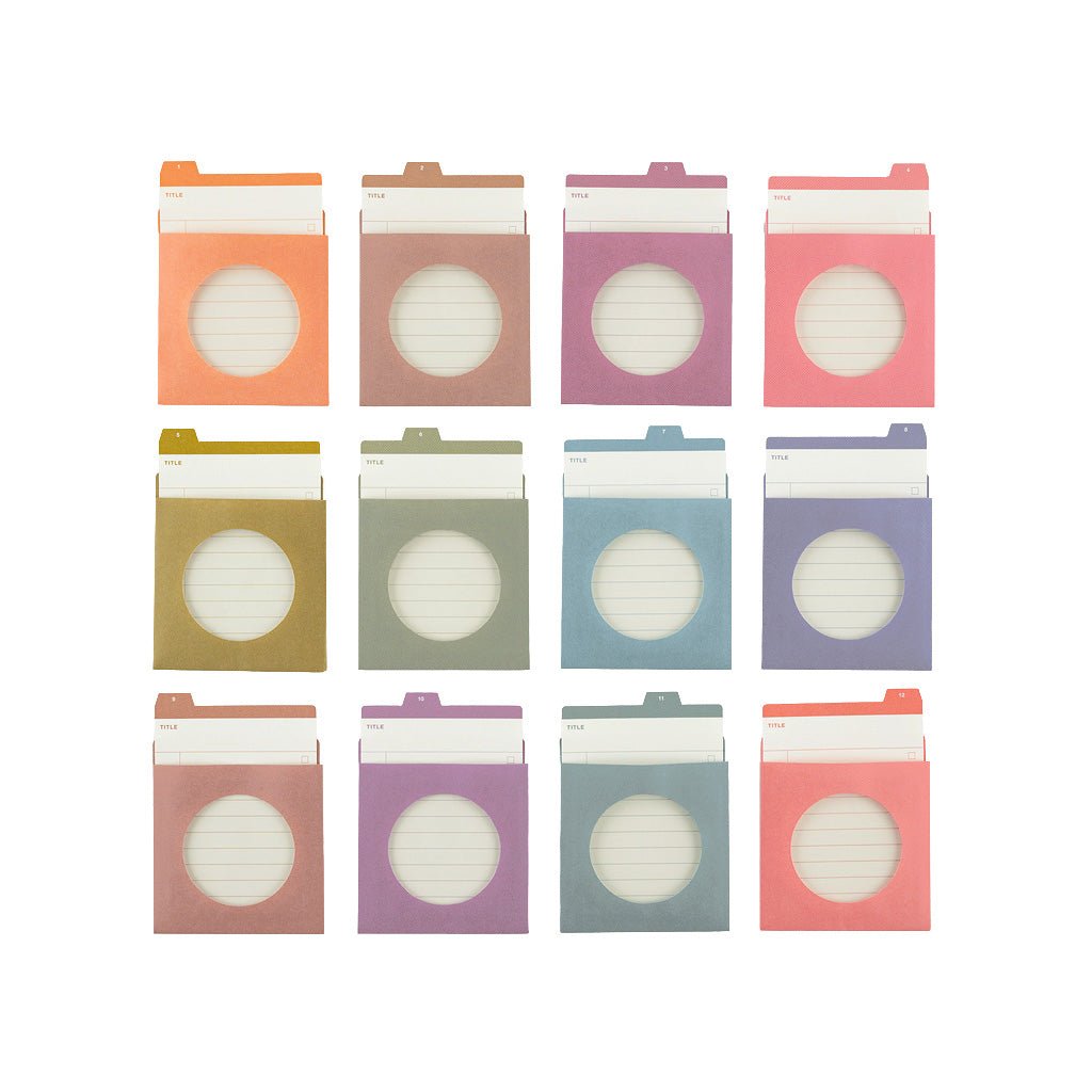 Twelve pastel-colored file folder inserts with circular cutouts, arranged in a 3x4 grid on a plain white background.