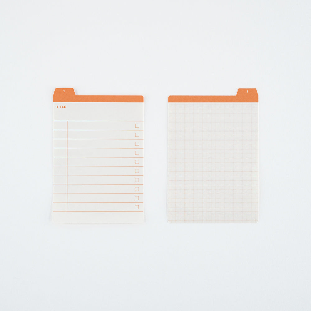 Two white planner inserts with orange tabs, shown on a clean white background. One insert features a lined table with checkboxes, and the other features a light grid pattern.