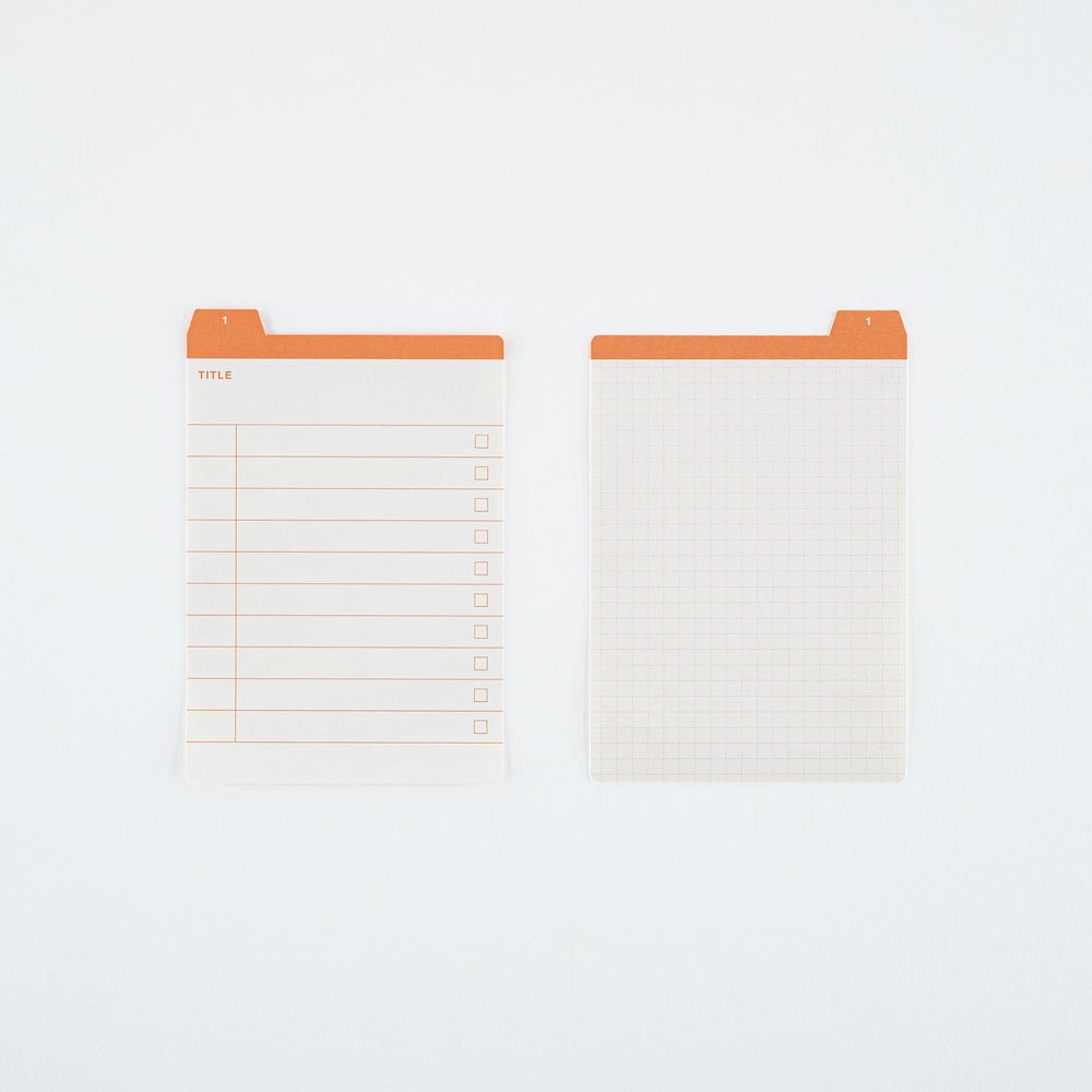 Two white planner inserts with orange tabs, shown on a clean white background. One insert features a lined table with checkboxes, and the other features a light grid pattern.