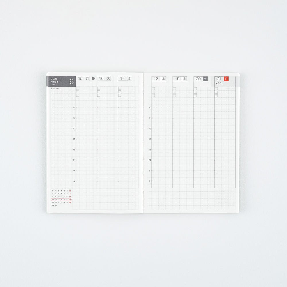 An open weekly planner with two grid pages, featuring a minimalist white design with light gray lines and small red date highlights, photographed on a clean white background.