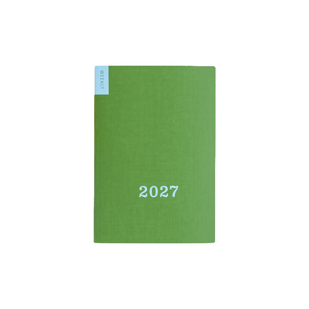 Green Hobonichi weekly calendar with blue '2027' text on front on white background
