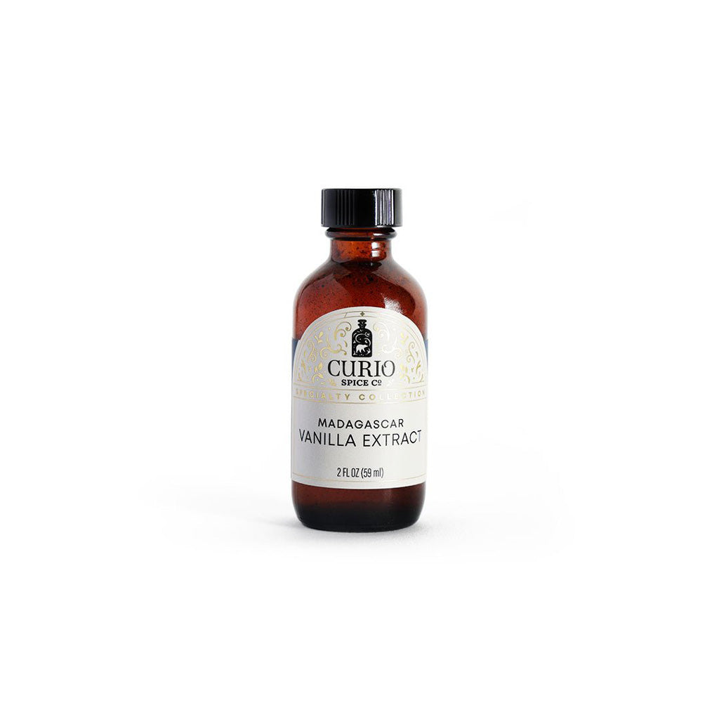 Bottle of Curio Spice Co. Madagascar Vanilla Extract on a white background
