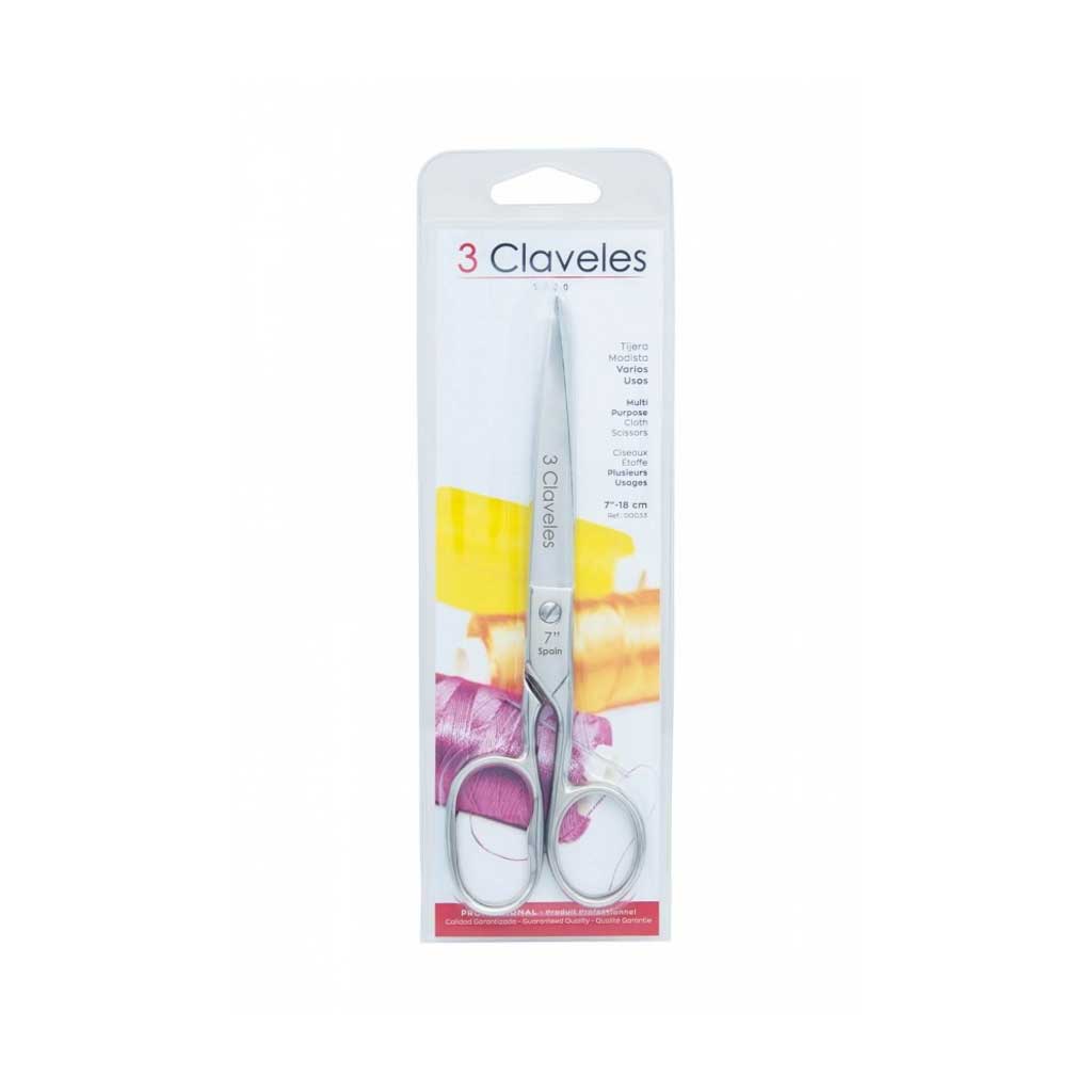 Packaged scissors with '3 Claveles' branding on a white background
