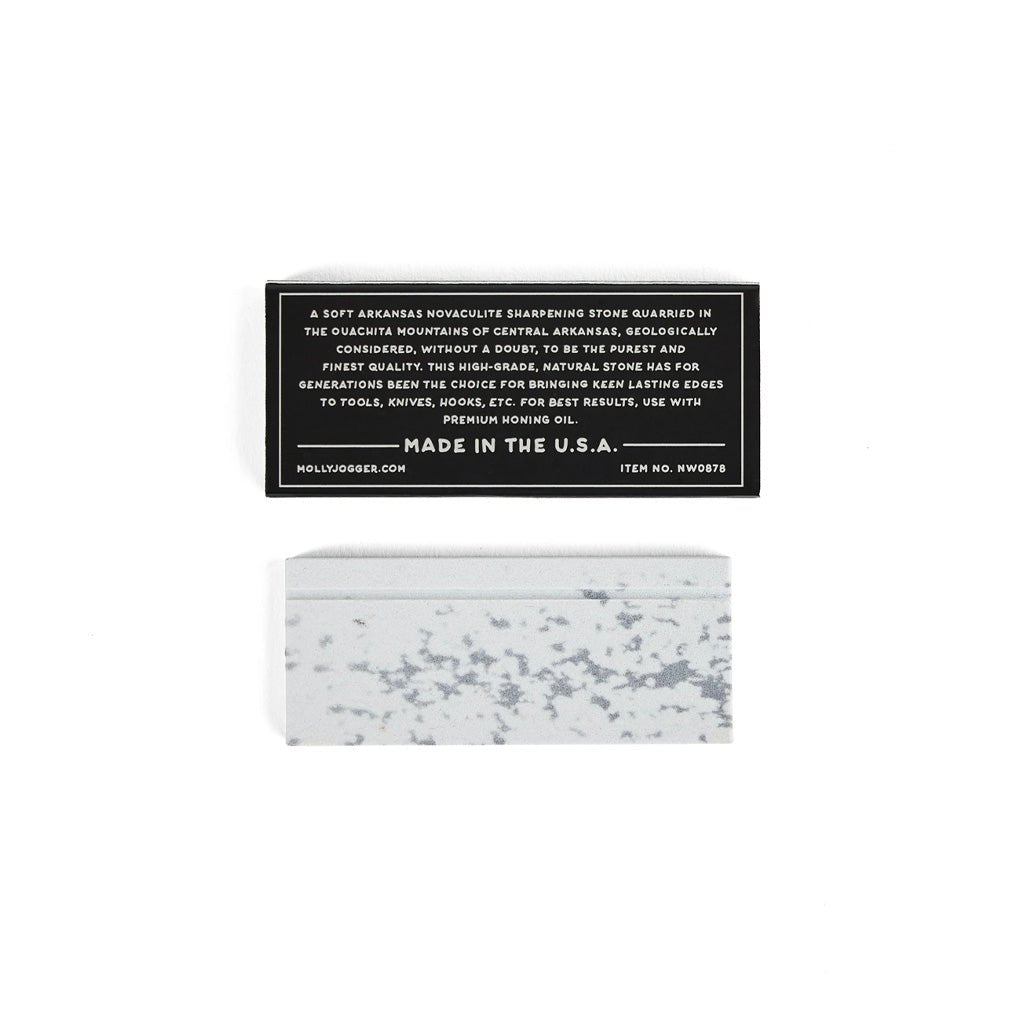 Ironquill sharpening stone on white background next to box with text