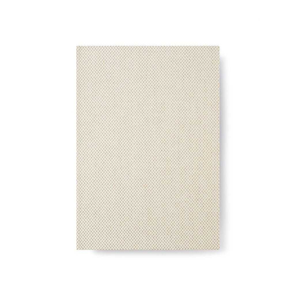 Textured beige notebook on white background