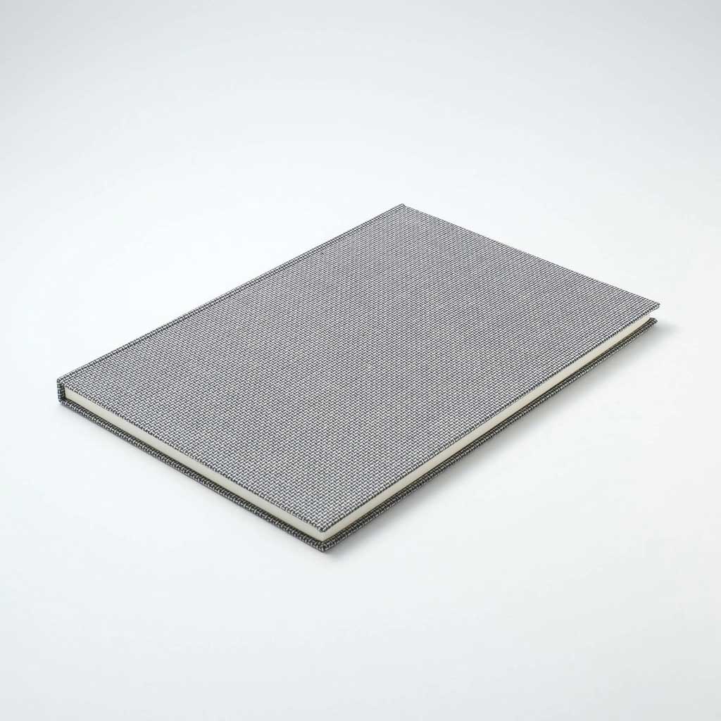 Textured gray A5 notebook on a white background
