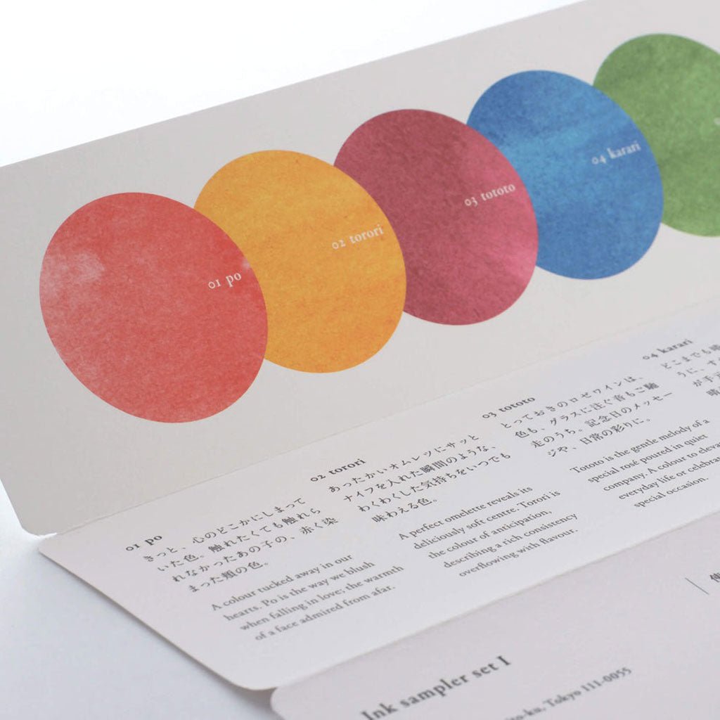 Color swatch book with colored circles and text on a white background