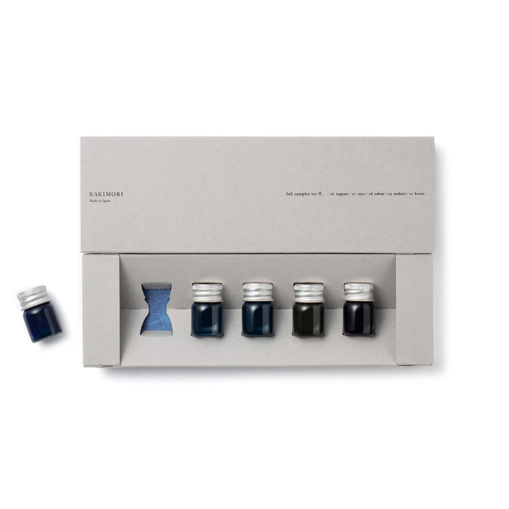 Set of ink bottles in a gray box with Kakimori branding on a white background