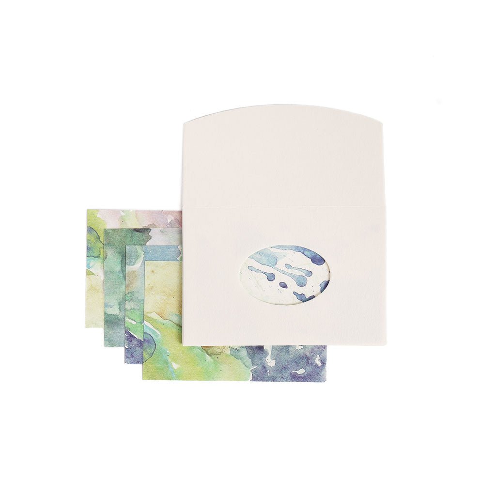 Set of stationery items with watercolor designs on a white background