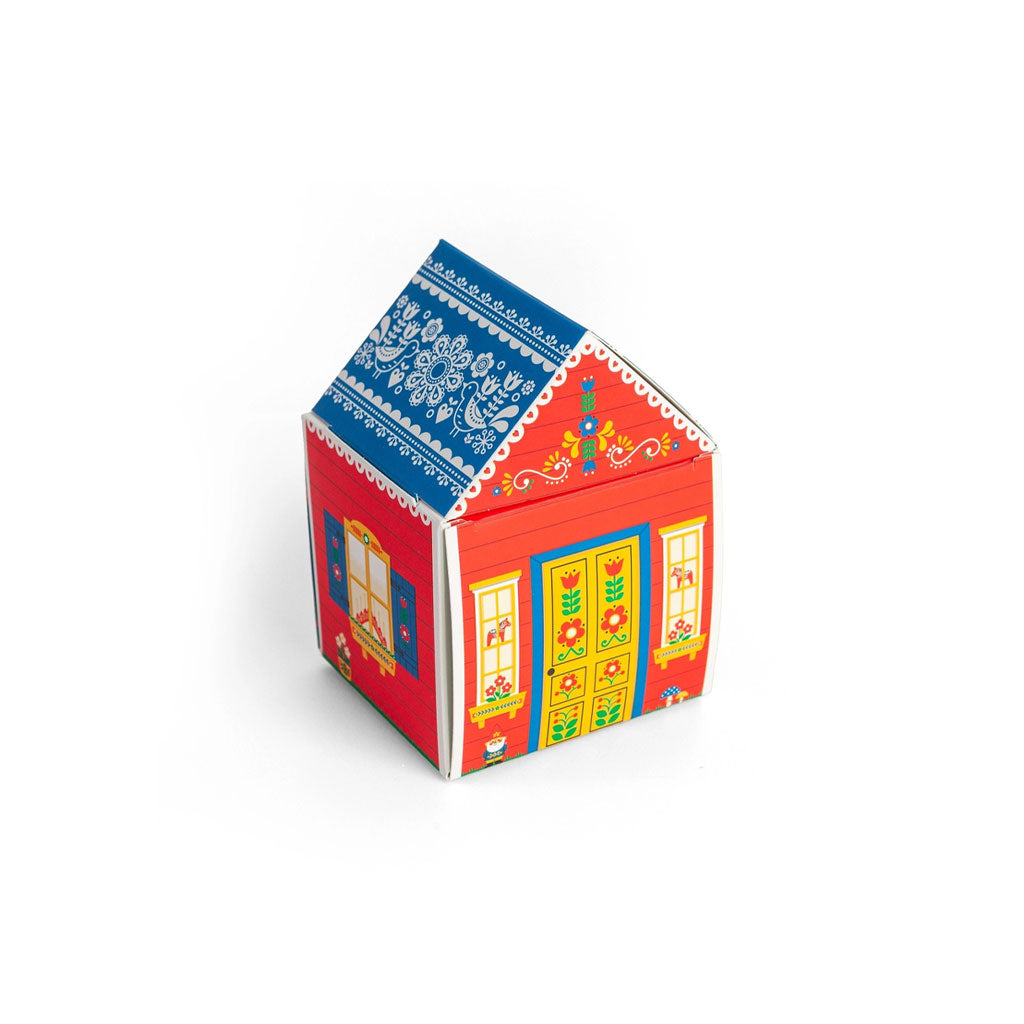 A small decorative house-shaped box with colorful accents.