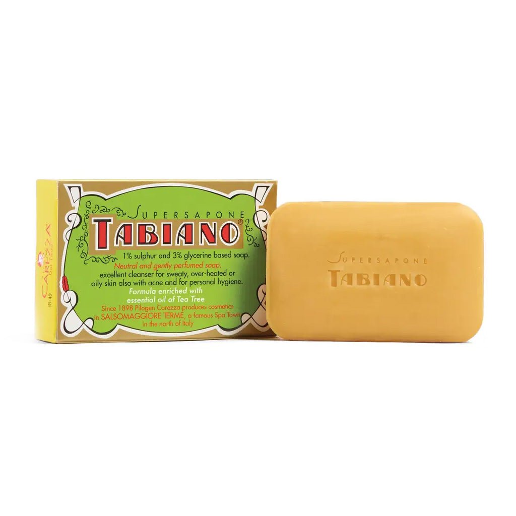 A bar of Tabiano soap next to its green and yellow packaging box, on a plain white background.