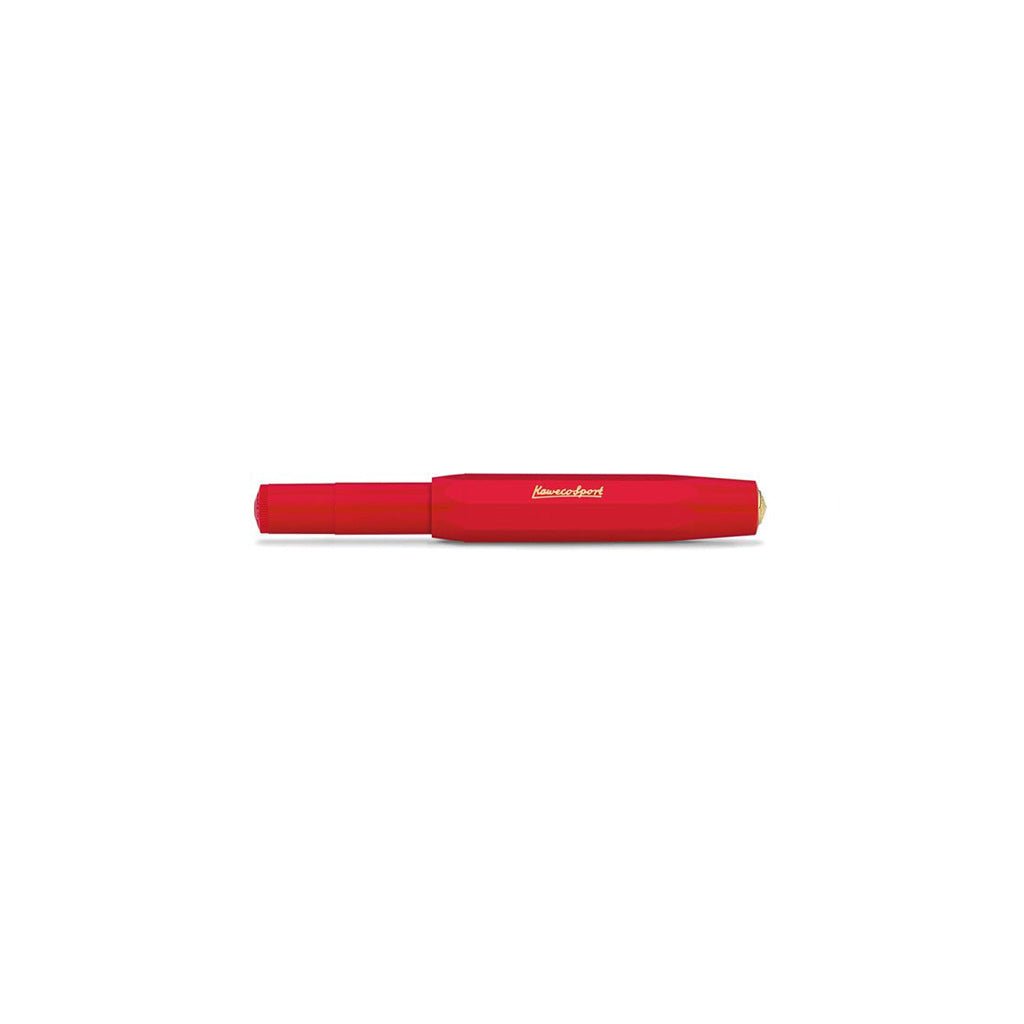 Red fountain pen with cap closed on a white background