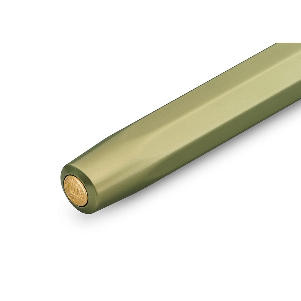 Green pen with gold cap on a white background