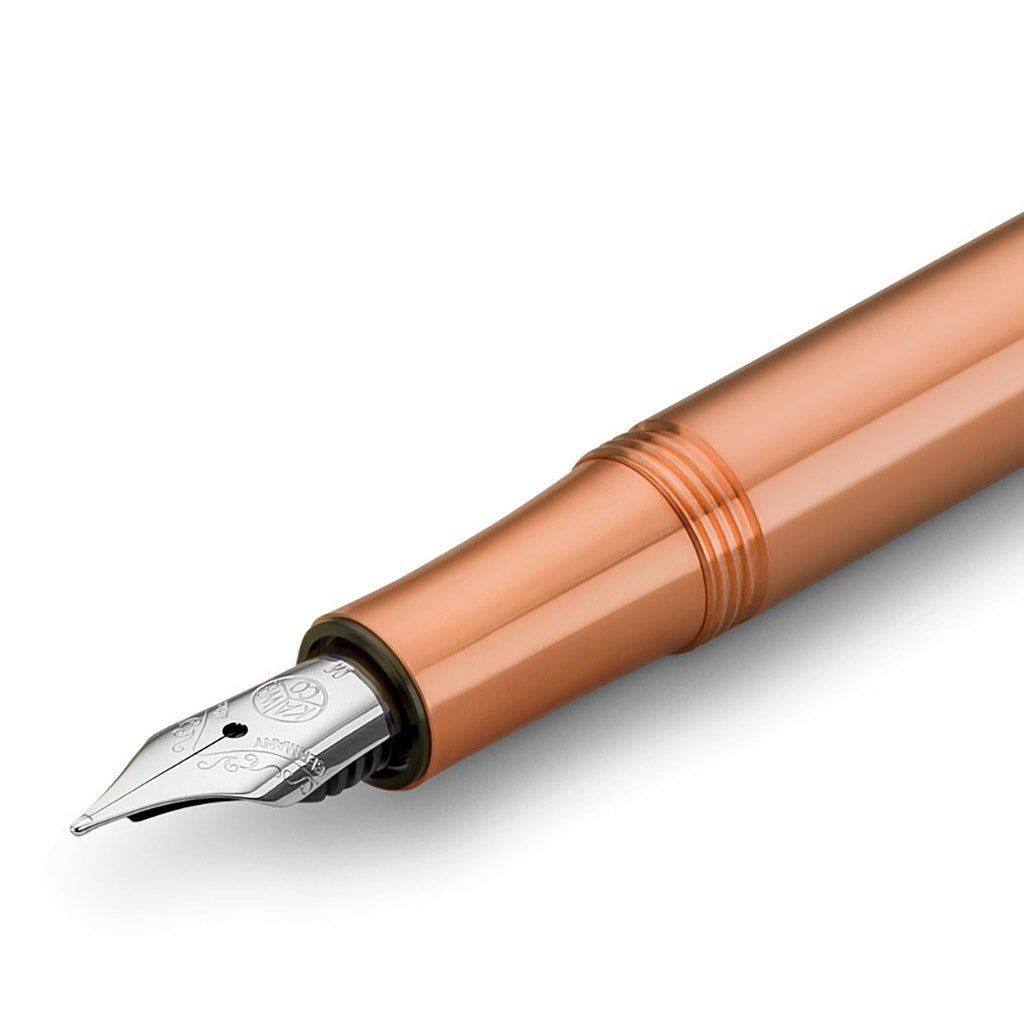 Copper fountain pen on white background