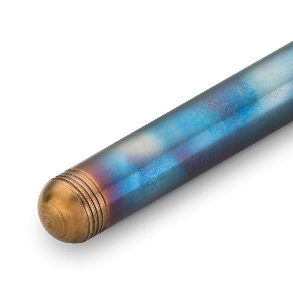 Close-up of a blue and purple fountain pen with a brass-colored end on a white background