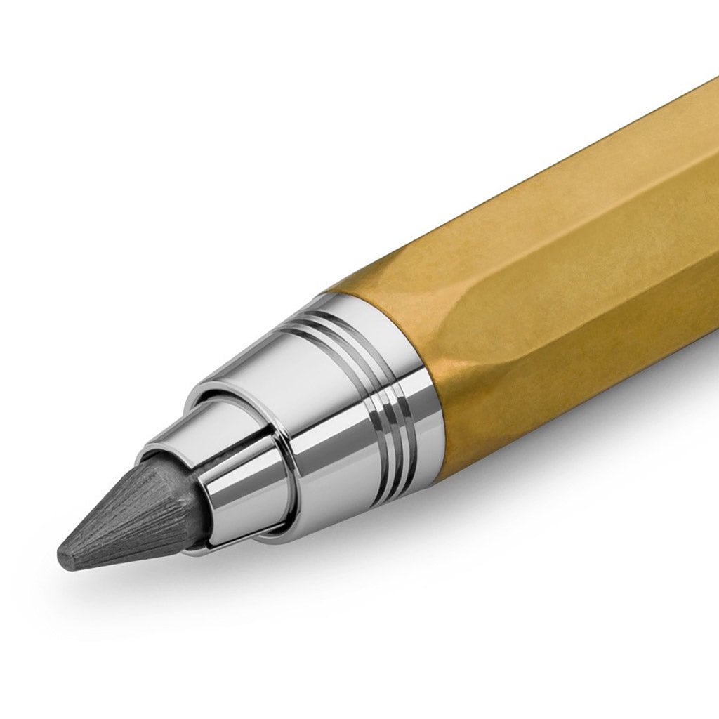 Close up of brass pencil with chunky lead on white background