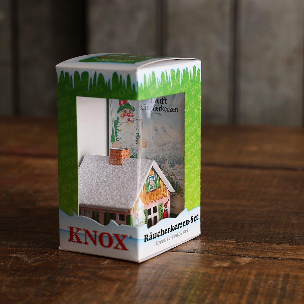 Knox Smoker House Incense Holder Kit in green and white packaging, featuring a miniature cottage with a snow-covered roof.