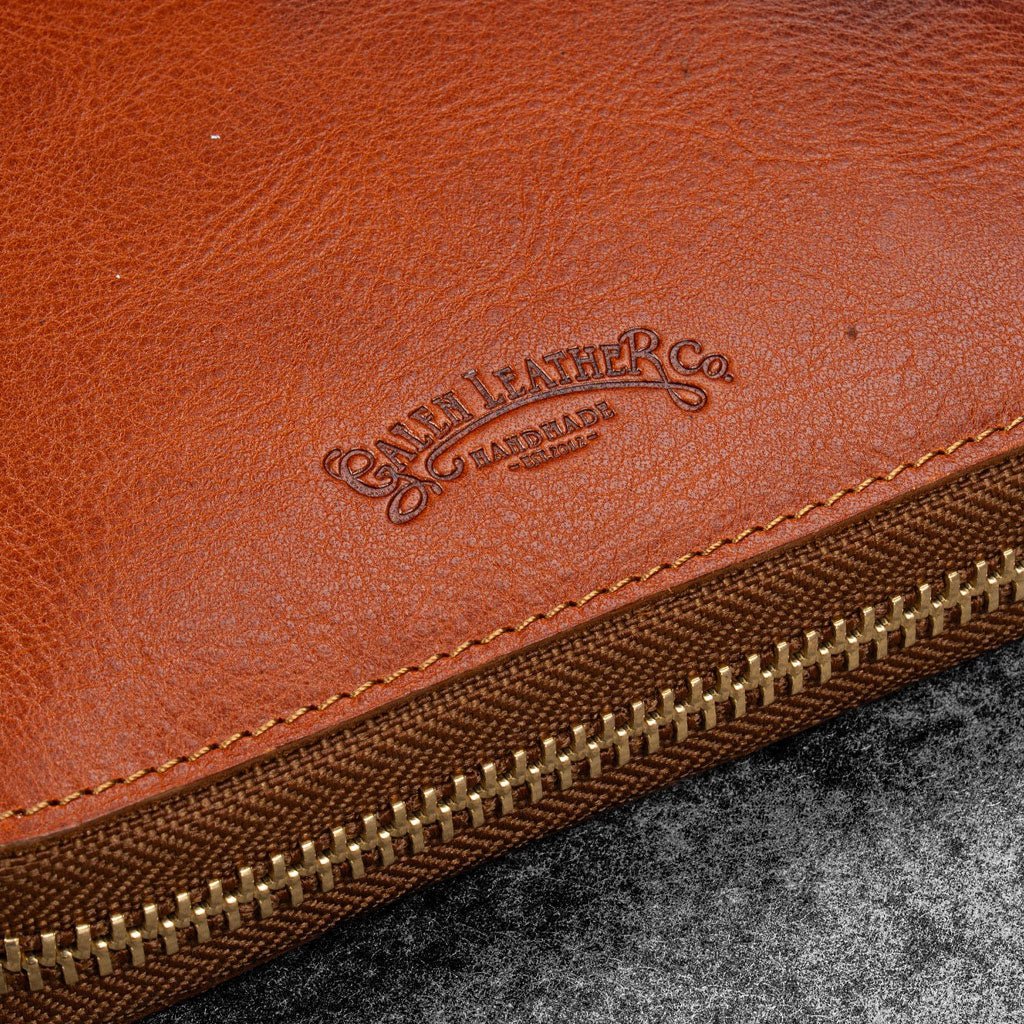 Brown leather zip pen case with Galen Leather branding against dark background