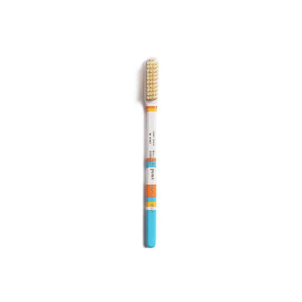 Light blue and white colorful toothbrush on white background