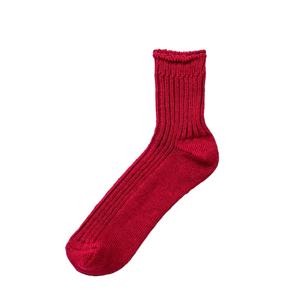 Antique red linen ribbed sock on white background