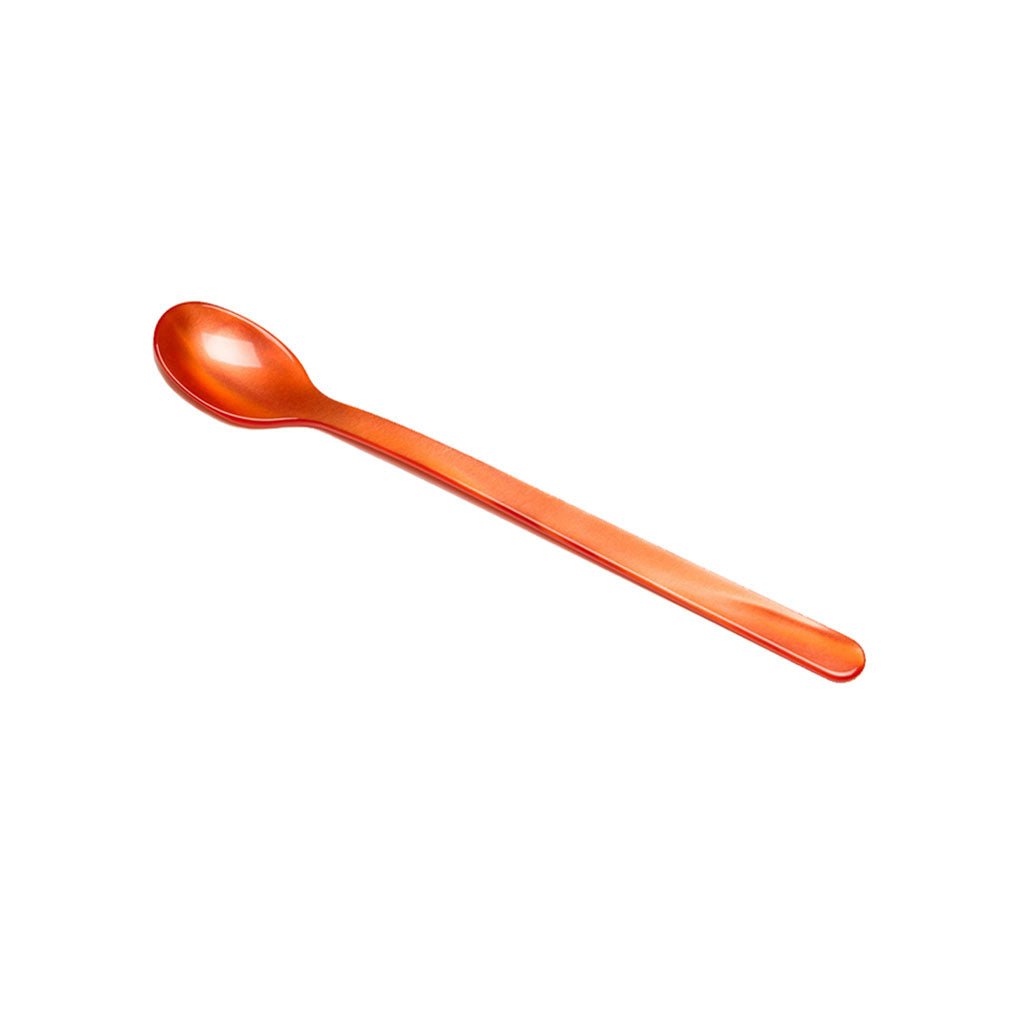 Coral red acrylic long drink spoon on white background