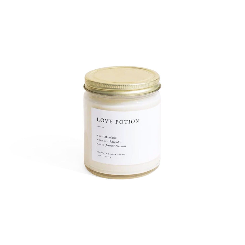 Candle jar labeled 'Love Potion' on a white background