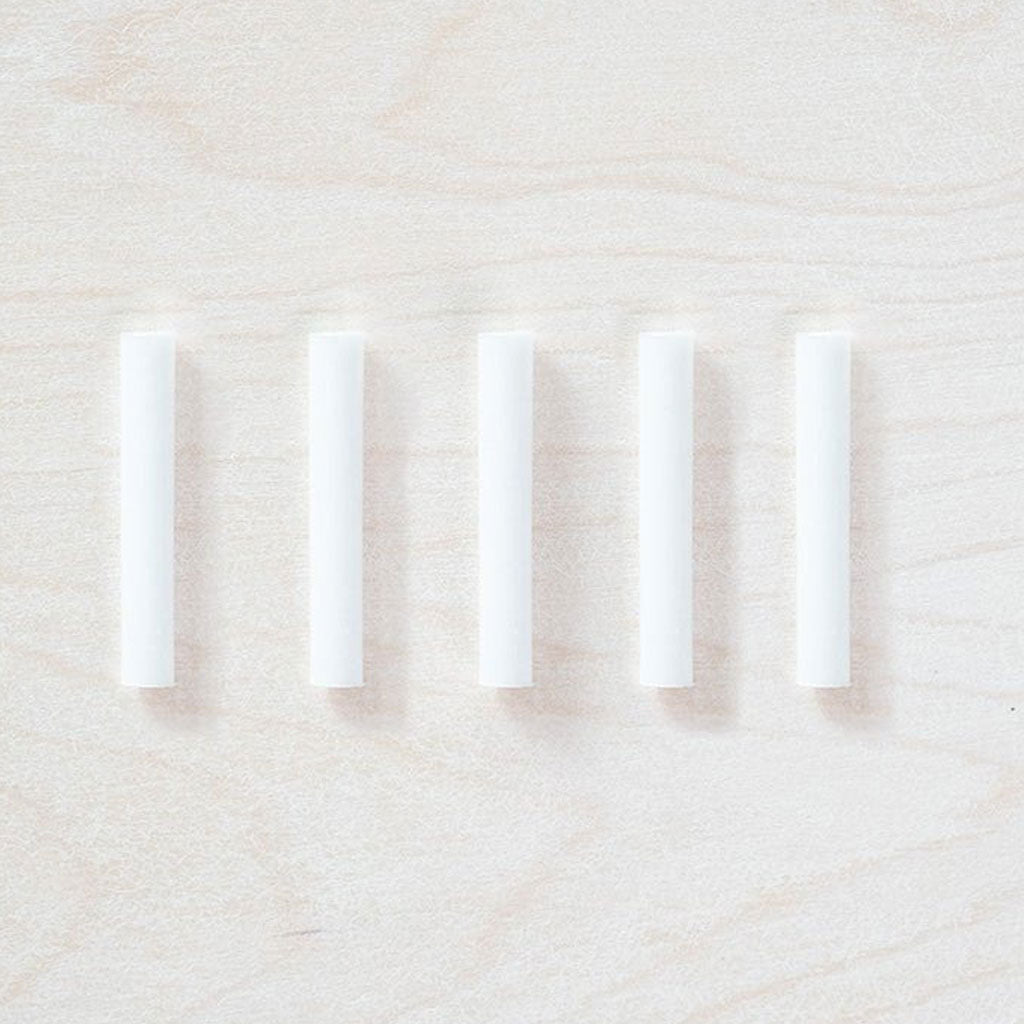 Set of 5 ink reservoirs on wooden background