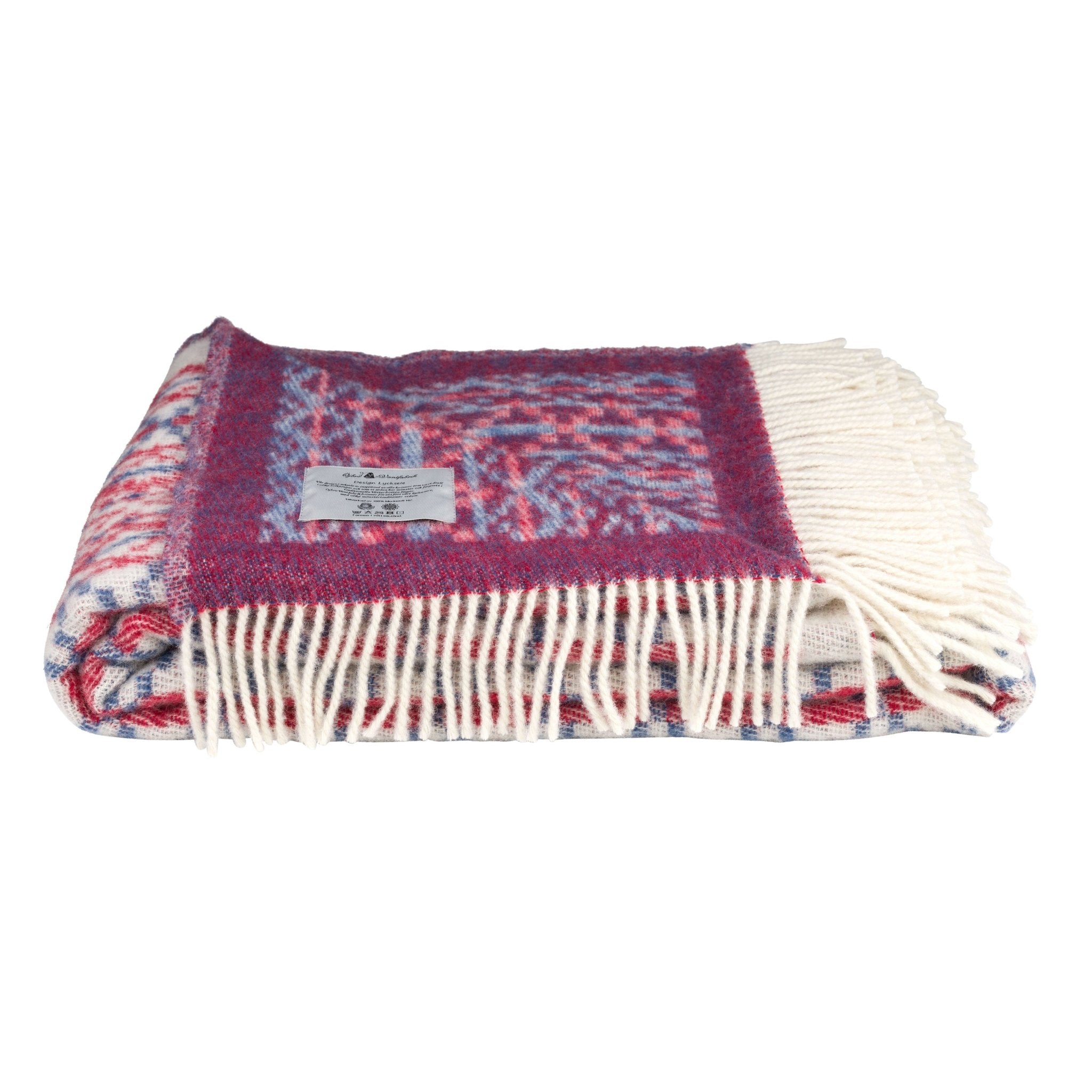 Woven blanket with fringes on a white background