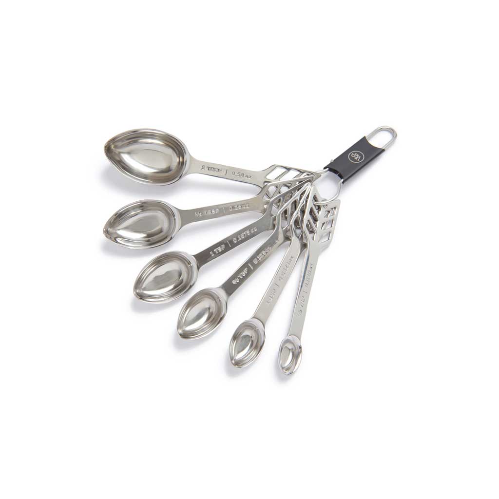 Set of stainless steel measuring spoons with a white background