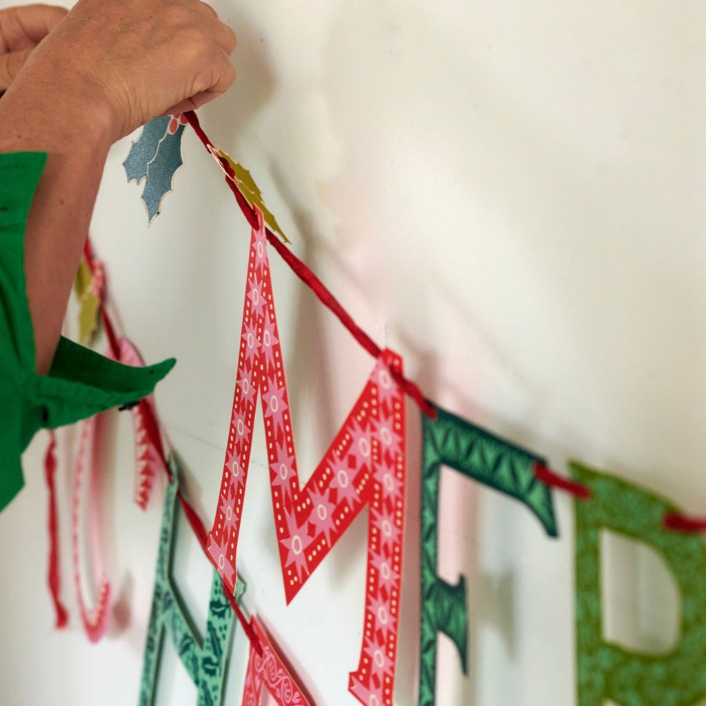 A person hanging up the banner