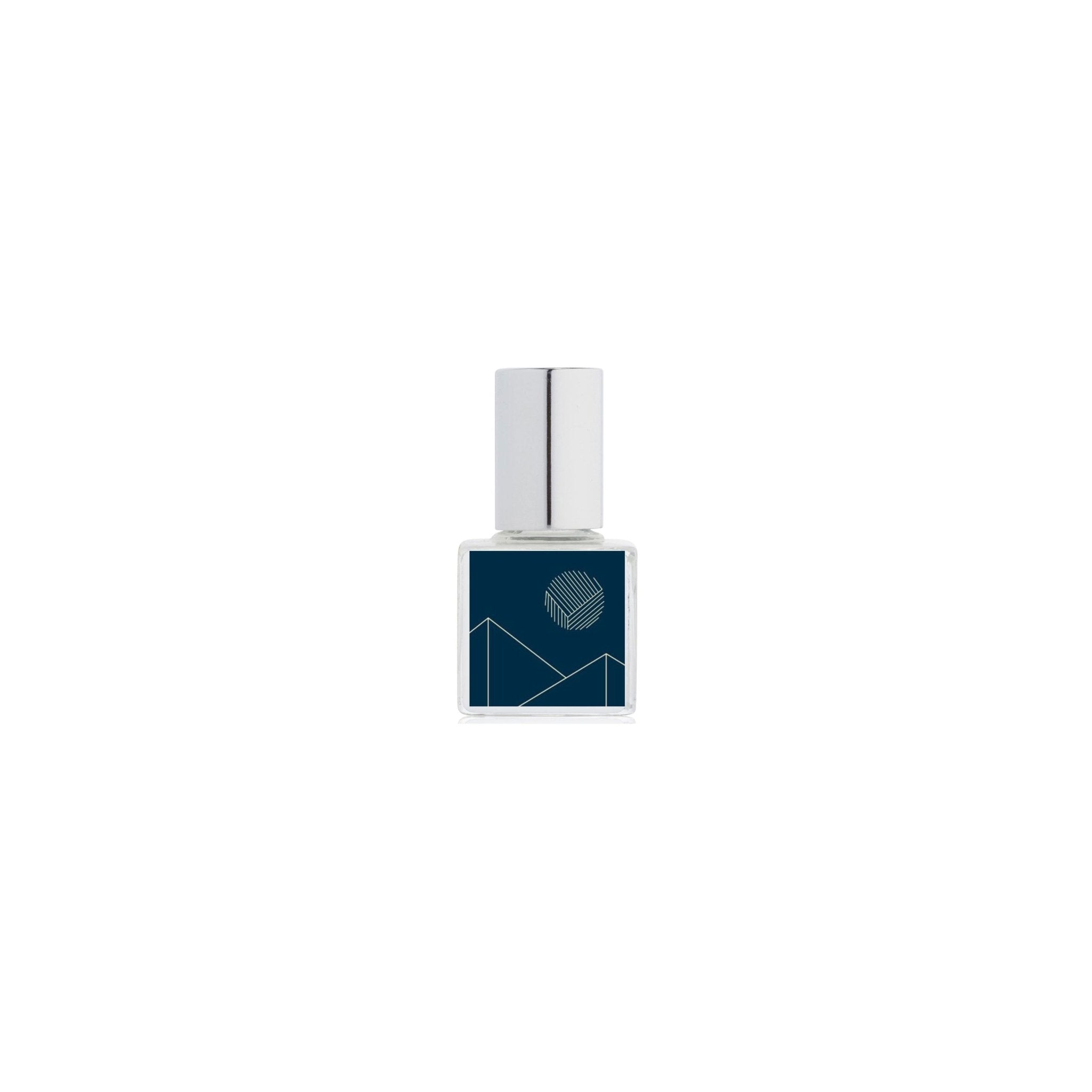 Perfume bottle with blue geometric design on a white background