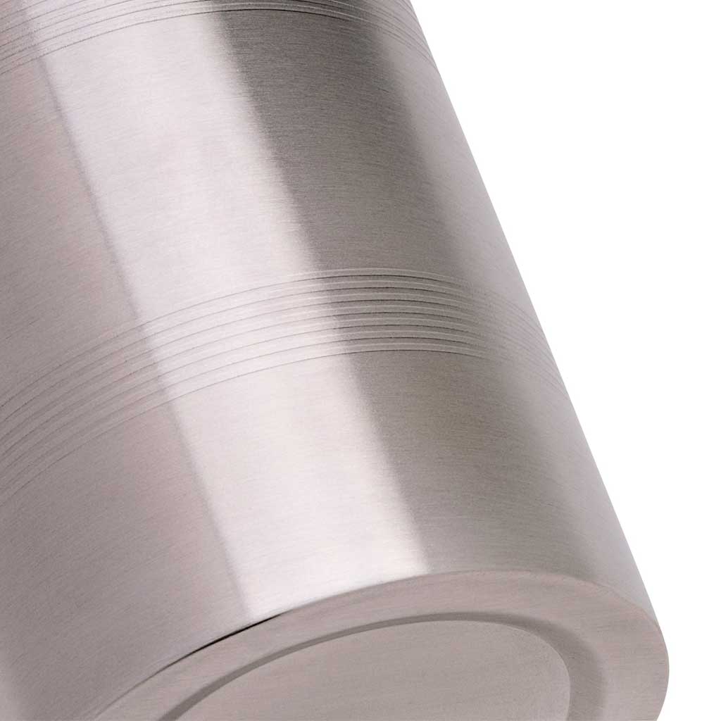 Close up of stainless steel banded cocktail mixtin on white background