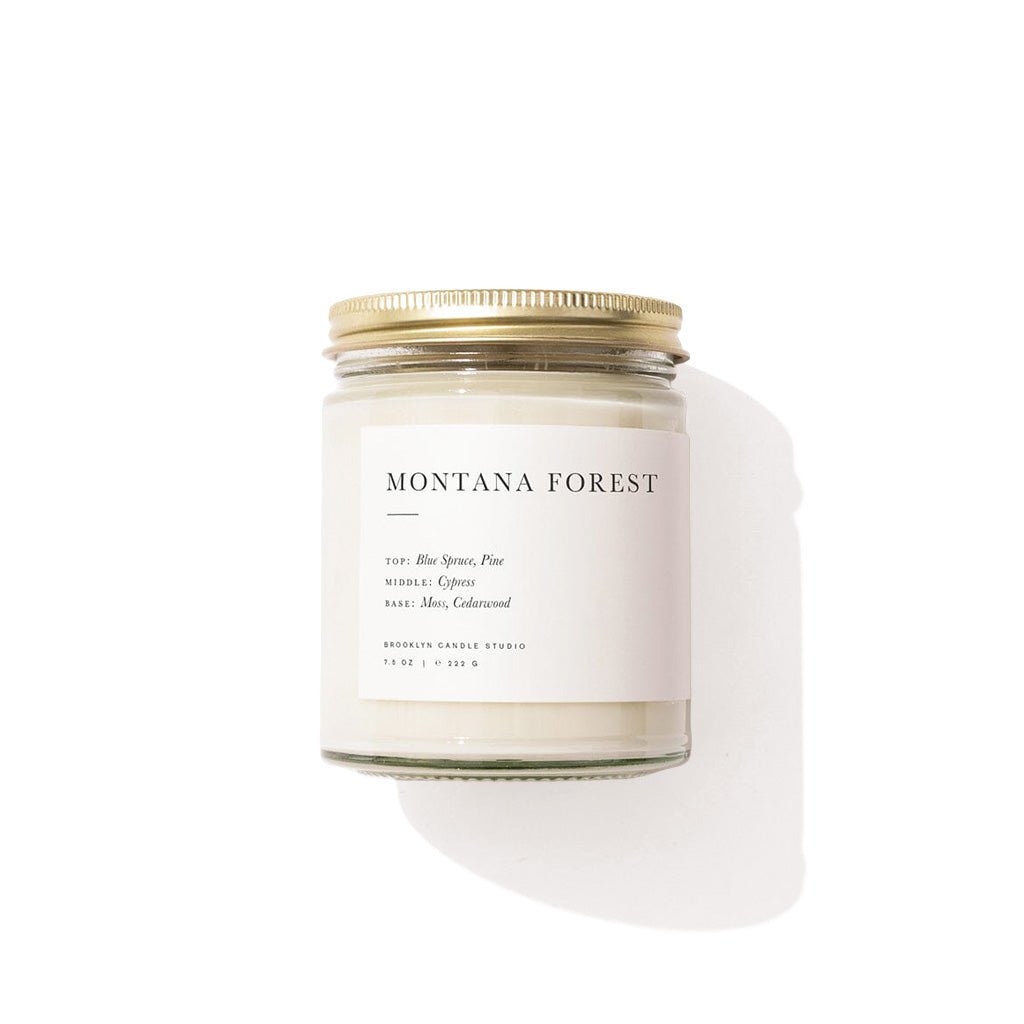 Candle jar labeled 'Montana Forest' on a white background