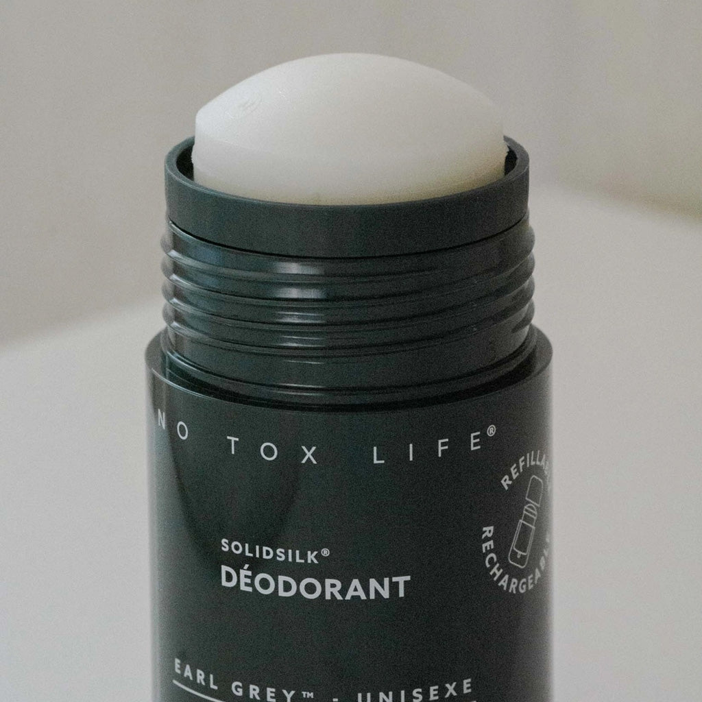 Open black Earl Grey deodorant tube.