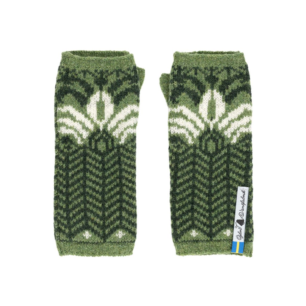 Outside pattern of green knit wool wristwarmers with white details.