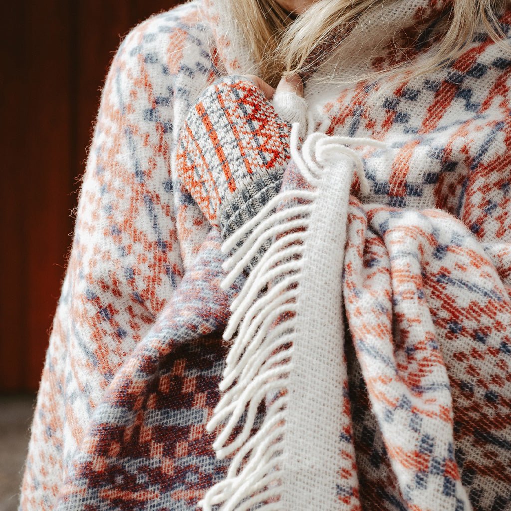 Person wrapped up in wool Lycksele blanket.