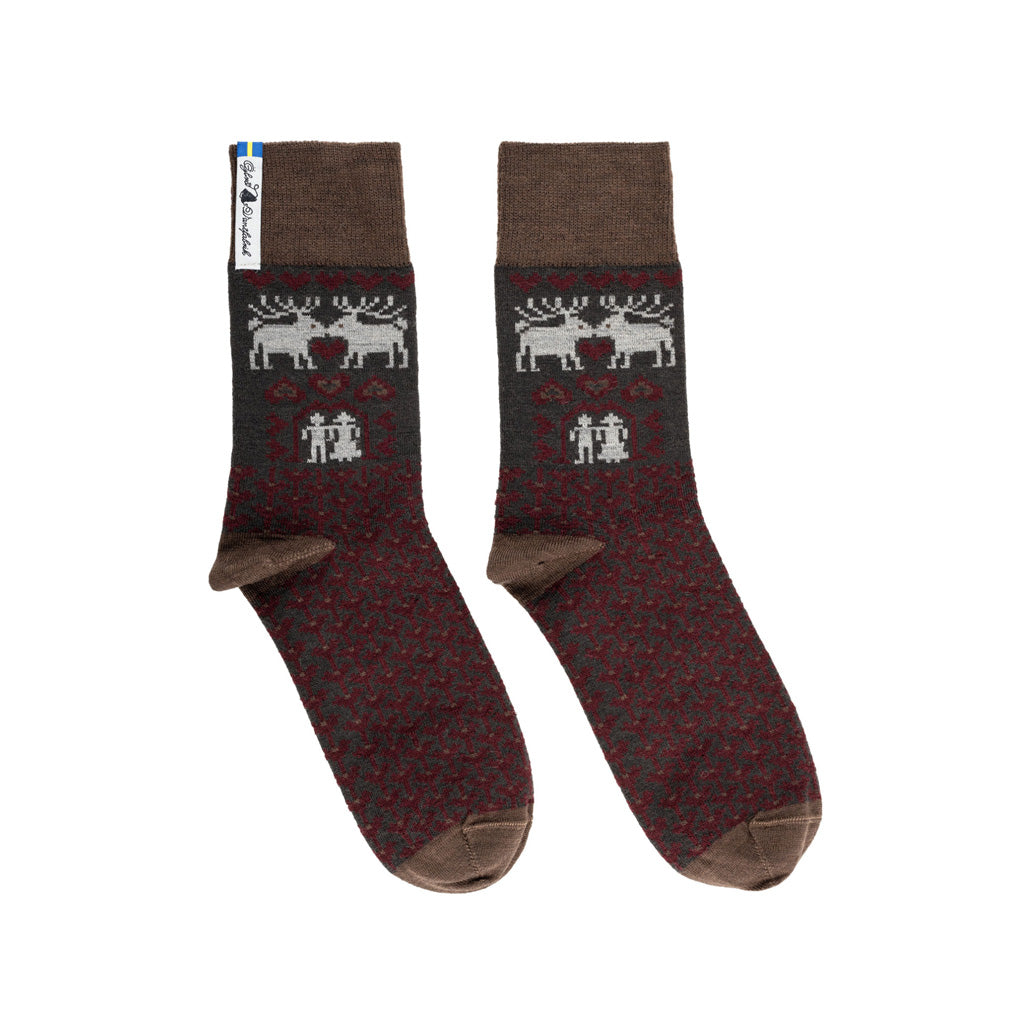 A pair of brown and red patterned merino wool socks.