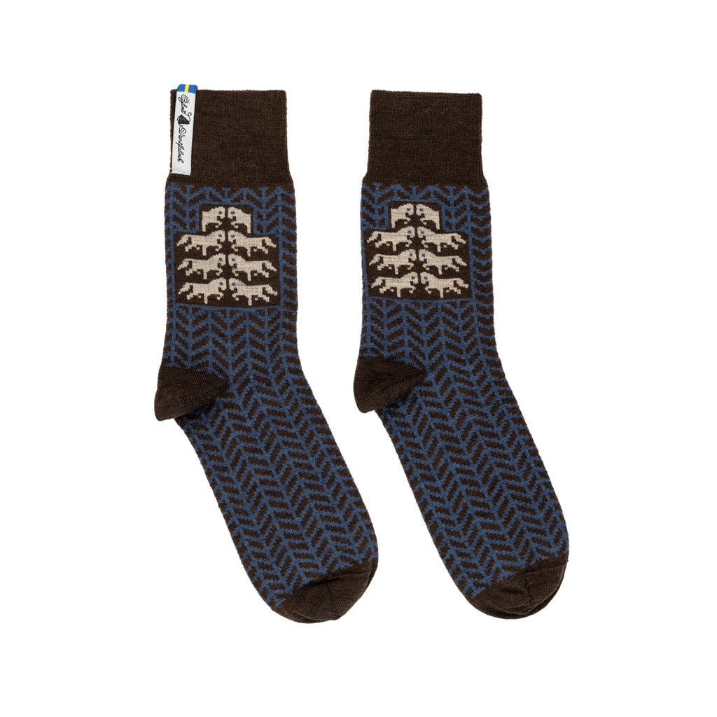 A pair of brown and blue patterned merino wool socks.