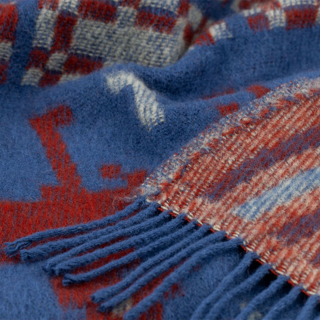 Close-up of wool blanket with fringe.