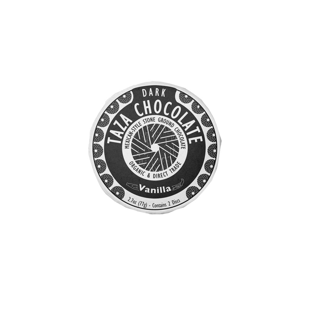 Taza organic stone-ground dark chocolate disc with vanilla in packaging on white background
