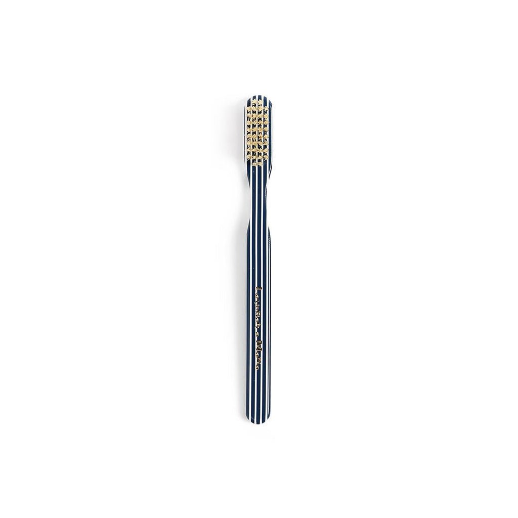 Dark blue striped toothbrush on white background