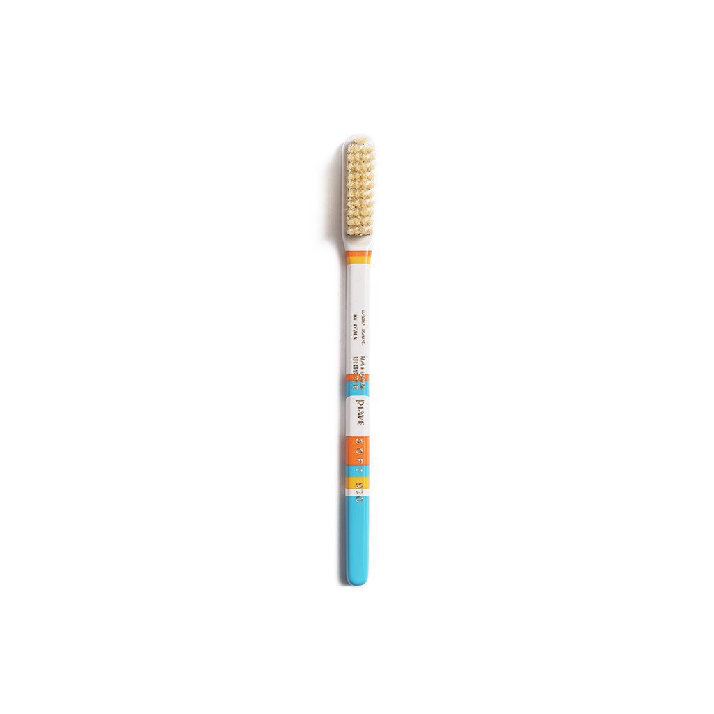 Light blue and white colorful toothbrush on white background
