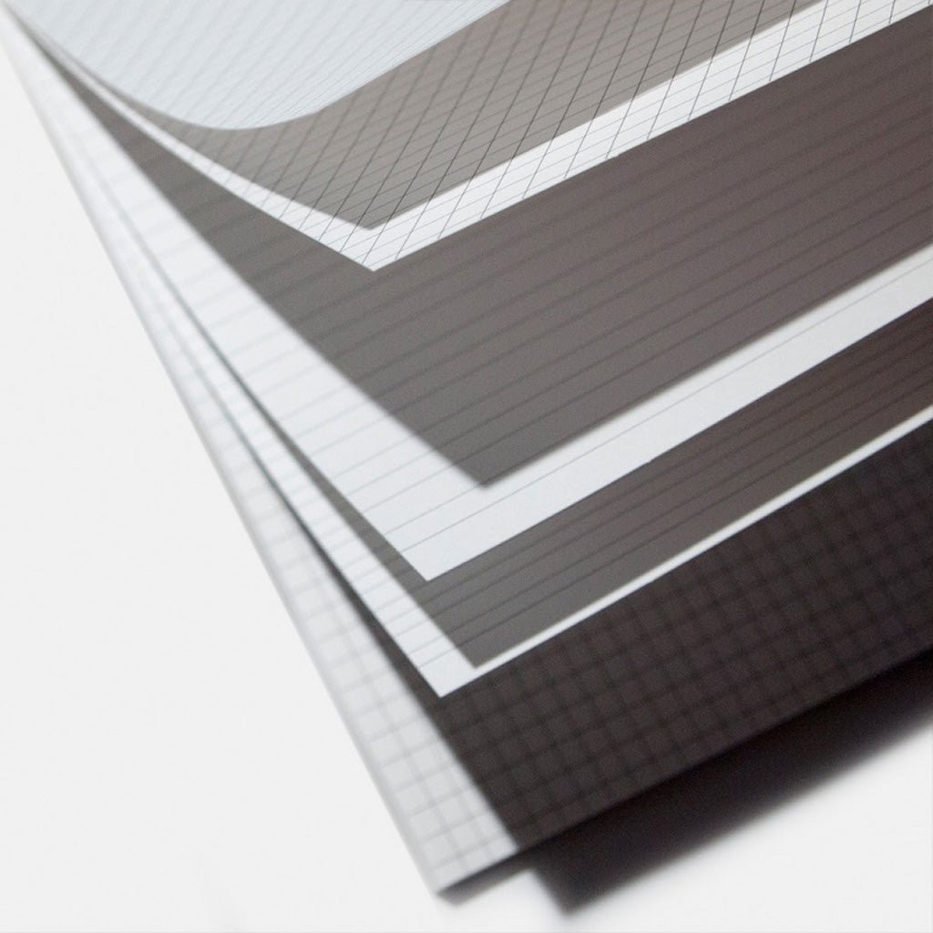 Various practice sheets in lettering guide book on white background