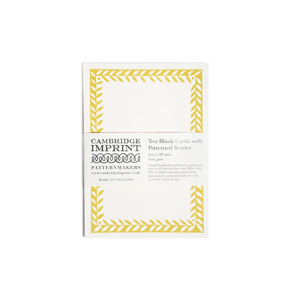 Pack of Cambridge Imprint yellow patterned border cards on a white background