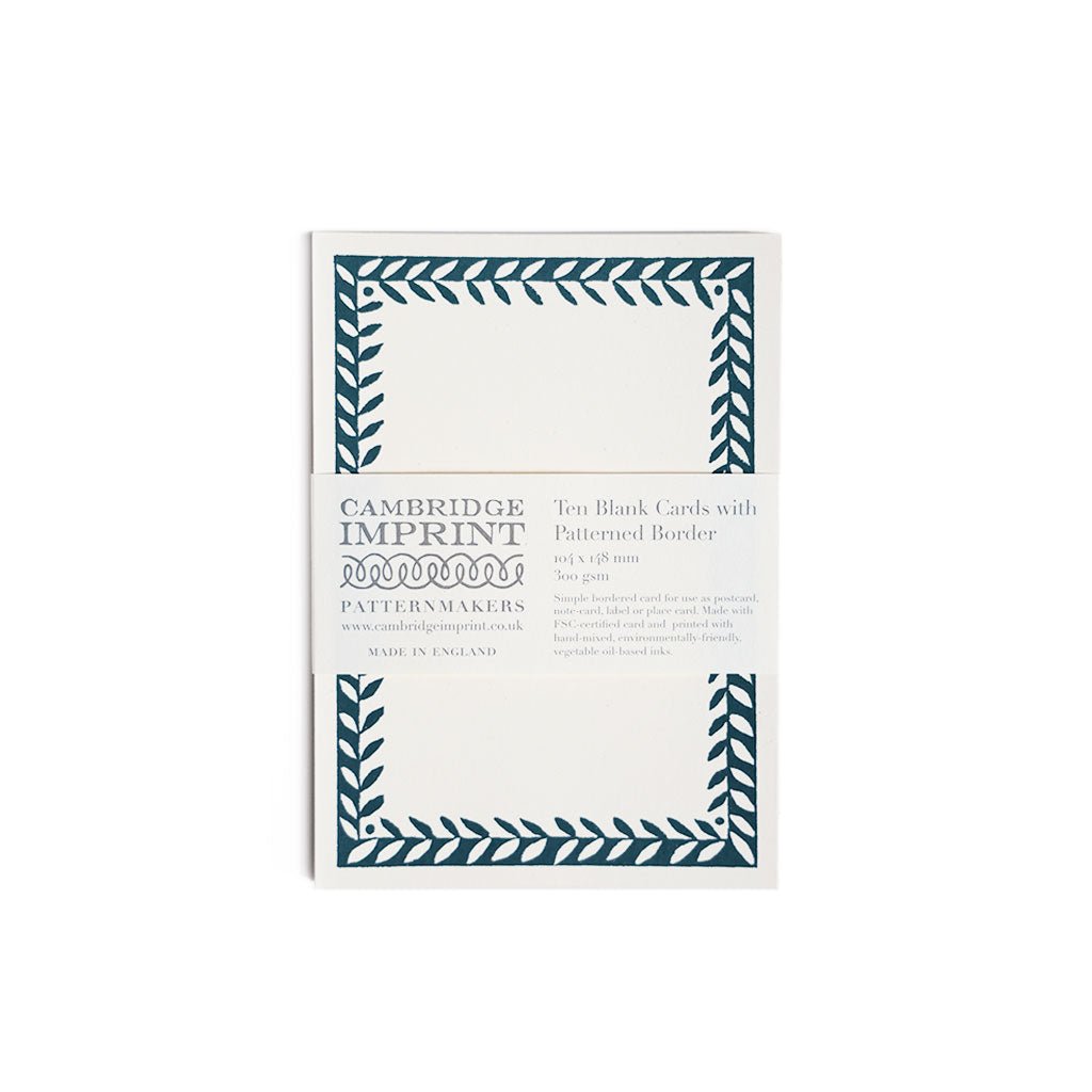 Pack of Cambridge Imprint blank cards with blue patterned border on a white background